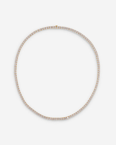 Crystal Embrace goudkleurig tennis ketting, symbool voor zuiverheid en sprankelende energie.